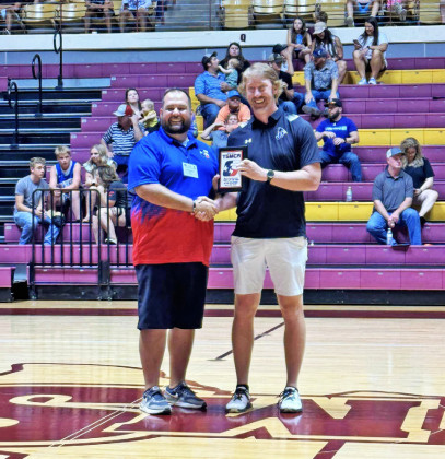 COACH OFTHEYEAR At the annual meeting of theTexas Six-Man Coaches Association Saturday in Wichita Falls, the organization named Jayton coach Ryan Bleiker (right) Boys Basketball Coach of the Year. Bleiker’s Jaybirds won the first state championship for Jayton boys basketball in March. Presenting the award to Bleiker was Jayton colleague and head football coach Josh Stanaland (at left). | COURTESY PHOTO