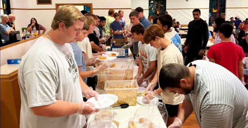HELPING OTHERS The Jaybird Football team and coaches spent time last week doing community service at the Hope Community Church in Lubbock. | COURTESY PHOTOS
