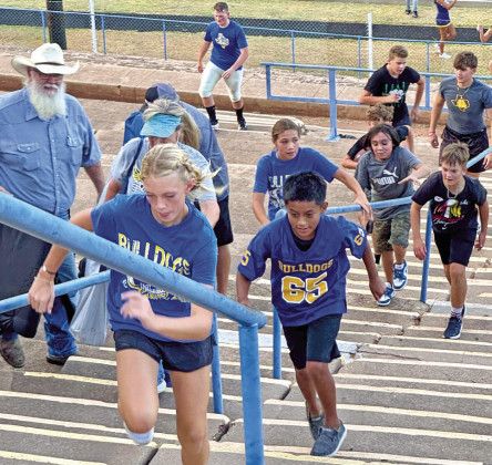 MEET THE BULLDOGS, SPURETTES Spur families, students and fans got their opportunity to Meet the Bulldogs and the Spurettes Friday night at Jones Stadium.The football team scrimmaged the Kress Kangaroos, new to the realigned district.The gridiron action was followed by an ice cream supper. See more photos on page 9. | TEXAS SPUR PHOTO