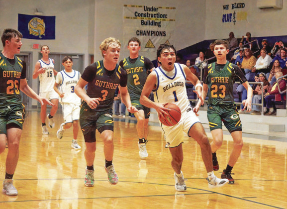 DOGS WIN The Spur boys basketball earned their first district win of the season, defeating the Guthrie Jaguars 49-39 on the road. | COURTESY PHOTO