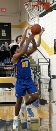 DISTRICT WIN Bulldog Willie Ortiz (20) battles for a rebound against Guthrie. | SUE JANE SULLIVAN