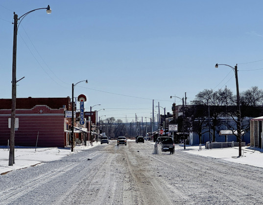SPUR’SBURLINGTONAVENUE resembled a much-used ski run by Monday, Jan. 26; by late afternoon parts of the street surface had thawed, and shoppers were out and about between Spur Hardward and Lawrence Brothers IGA—and the Lucky Spur boutique. | COURTESY PHOTOS