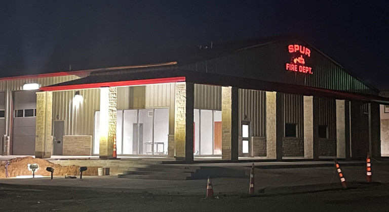 LIGHTING UPTHE FIREHOUSE Two weeks ago the illuminated sign was erected on the front of the new Spur fire station; soon afterward, outside lights were also turned on. | THE TEXAS SPUR