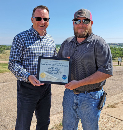 QUARTER CENTURY The White River Reservoir Water Treatment Plant was recognized last week with a 25Year Honored Institution award. Staff member Brice Bownds (right), the plant’s current observer, accepted the award from Lubbock Weather Forecast Office meteorologist in charge (MIC) Justin Weaver (left). | COURTESY PHOTO
