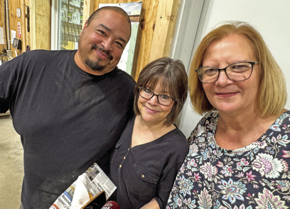 SMILING FACES of Crosby County Fuels staffers Luis Guzman, McAdoo manager, and Chris Hunt and Freda Hitt of the home office in Ralls.