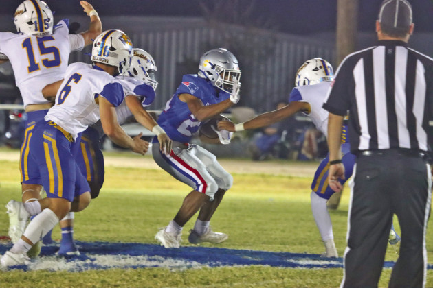 CIRCLED BY BULLDOGS, the Patriots found themselves frequently cut off from increasing their score on their home turf Friday night. | SHADI BUCHANAN PHOTO