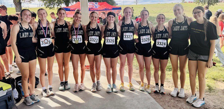 BOTH BRING HOME TROPHIES The Jaybirds and Lady Jays cross country squads both turned in top performances at the Lubbock meet Sept. 27. | COURTESY PHOTOS