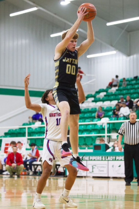 ONE GIANT LEAP Jayton makes the leap for the rebound.