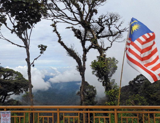 MALAYSIAN FLAG flies over the BOH tea factory, far above the clouds.