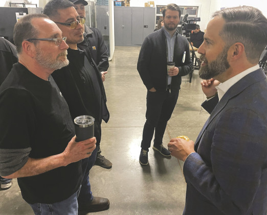CRYPTO COFFEE CHAT Galaxy Digital staffers Max and Kevin (right), along with the firm’s head of communications Mike Wursthorn, visited briefly at the end of a plant tour by Rep. Dustin Burrows (right). | THE TEXAS SPUR