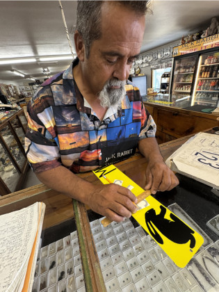 HERE HE IS The Jack Rabbit’s own Tony Jaquez crafted a miniature replica sign for us denoting 634 miles from our own headquarters in Spur, Texas, to here. | TEXAS SPUR