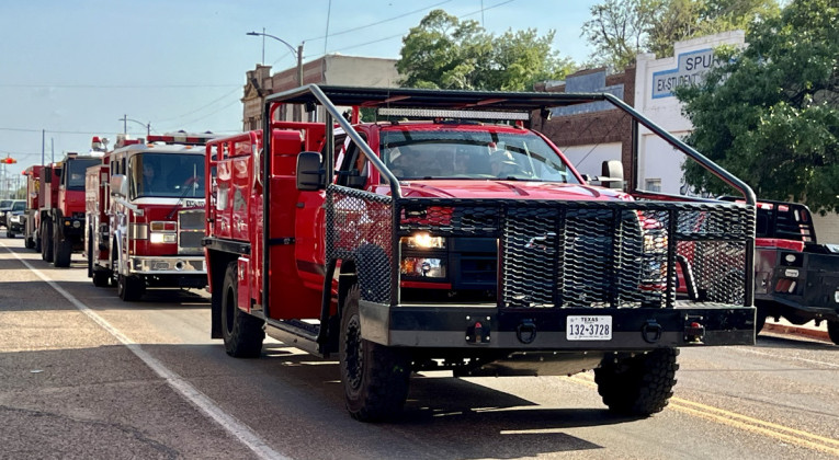 HEADED TO NEW HOME In a time-honored tradition, Spur VFD moved its equipment up Burlington Avenue to officially put the new station into service. | THE TEXAS SPUR