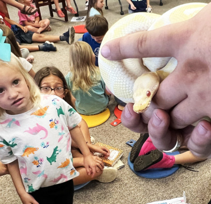 SNAKES, SQUIRREL AND A SHADOW The Dickens County-Spur Library's Summer Reading series continued this Tuesday at the library as the South Plains Wildlife Rehabilitation Center of Lubbock gave a presentation to dozens of local children. Featured animals included: a squirrel, a great horned owl, a barred owl named Shadow, a milk snake and a ball python. | COURTESY PHOTOS