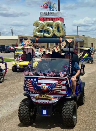 FESTIVE FOURTH Jay and Jodie Boland drove their patriotic entry, featuring a “Happy Birthday America” theme honoring the nation’s 250th anniversary, which earned top honors during the parade. | COURTESY PHOTO