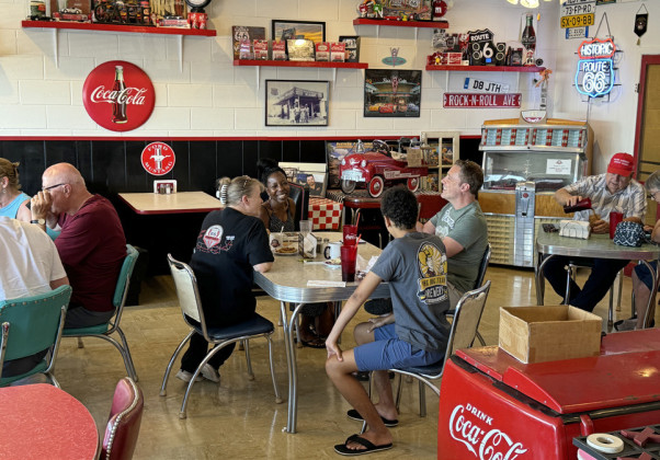 BRENDA AND BRENNEN talk turkey about Route 66 travel at her Midpoint Café in Adrian, Texas. | THE TEXAS SPUR