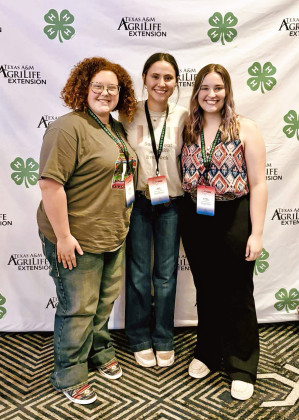 JERI HOLCOMB (center) of Spur ISD took part in two separate 4-H programs this summer. | COURTESY PHOTO