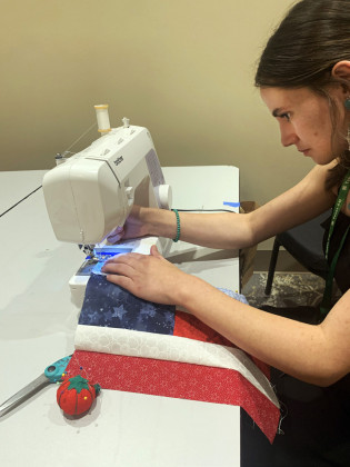 QUILT OF VALOR When the Dickens 4-H Club sewed quilt blocks for the national Quilts of Valor project, Holcomb was already an experienced hand at stitching. She has since helped others in the club learn, from basics to more advanced techniques. | COURTESY PHOTO
