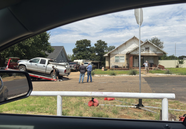 Spur resident drives pickup onto home property, strikes porch
