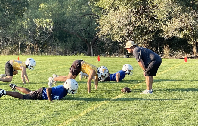 BACK IN THE BLUE The Spur Bulldogs have begun summer practices under the leadership of Head Coach Tate Clark (above, in left photo), who was outforanextendedsickleavein 2024. Last year the team went undefeated in District under the substitute coaching of Superintendent Craig Hamilton (above, in right photo)—who’s assisting in the early going this year. | TEXAS SPUR