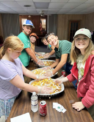 Making trail mix for communtiy service.