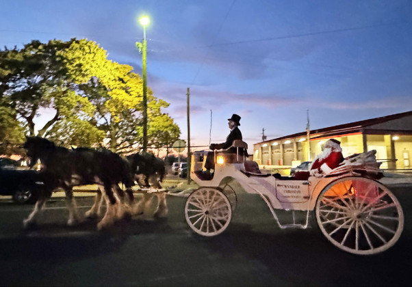 CARRIAGE CLAUS Santa Claus arrived in Spur for a visit last week and came via horse and carriage. | TEXAS SPUR PHOTO
