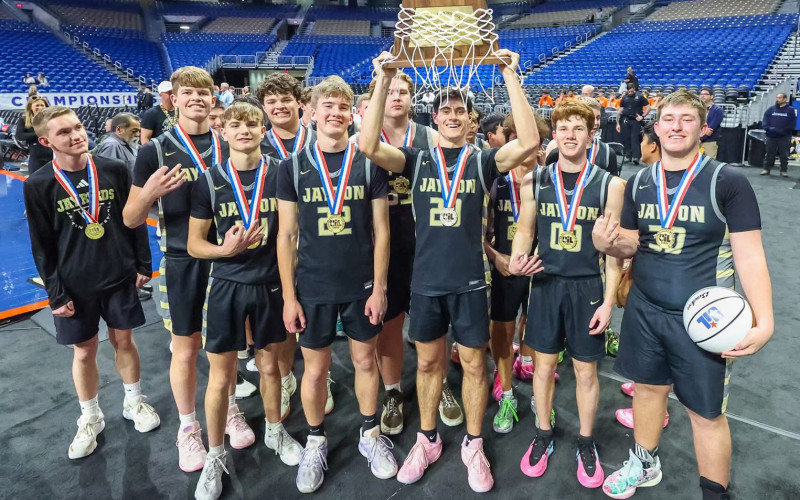 VICTORY AT THE ALAMODOME #1 Jayton Jaybirds no. 20, senior Colt Centry, hoists the State 1A D2 basketball championship trophy alongside teammates March 12, 2026, following a 78–45 victory over #13 Kennard. | COURTESY PHOTO