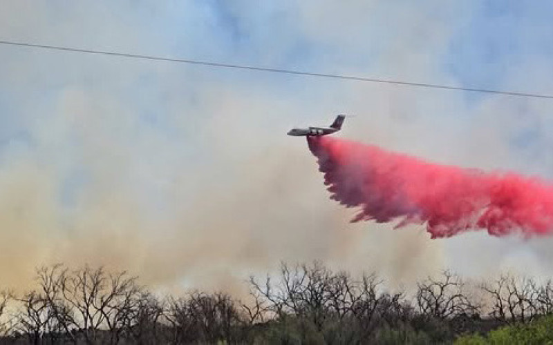 FLYING FIREFIGHTING A large airtanker dropped retardant on the Bell Fire in Dickens County on March 26, 2026. | COURTESY L. MCNEE; TEXAS A&amp;amp;M FOREST SERVICE.