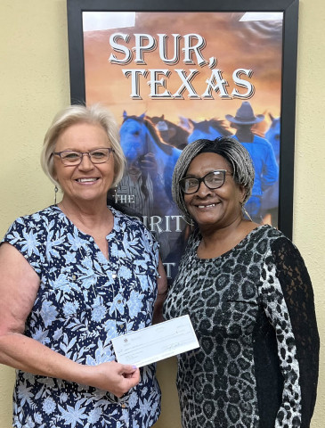 NEW BOOKS, NEW COMPUTERS will soon be on the way to the Dickens County-Spur Public Library, thanks to a grant of nearly $7,000 from the Tocker Foundation that was received this week by librarian Donnice Carruth (left) and Mayor Louise Jones. | COURTESY PHOTO