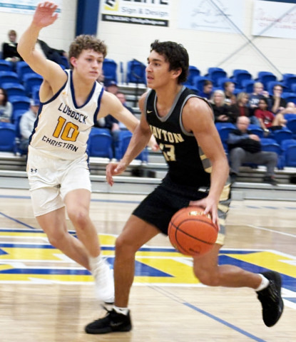 ON OFFENSE Jaybirds’ Sean Stanaland drives around a LCHS defender Feb. 20. | SUE JANE SULLIVAN FOR THE TEXAS SPUR