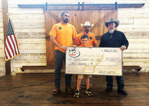 DICKENS4-HSHOOTINGSPORTS coaches Stephen Jones and Ruel Harold appeared with Ben Harold, RMEF Hub City Chapter, represented by Jody Duggan. | COURTESY PHOTO