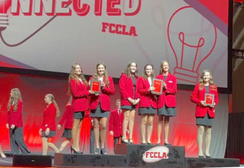 IN TOP THREE AT NATIONALS for the FCCLA (Family, Career and Community Leaders of America) national conference were Spur ISD students Allie Weiser, left, and Paisley Smith of Spur’s Cowgals Snowcones enterprise. The students received their honors at a July 10 ceremony (below) | COURTESY PHOTOS
