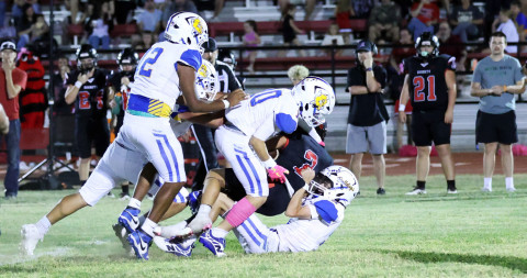 DEFENSE PRESSURE Spur's defense played an aggressive game in the physical 61-16 loss to the Aspermont Hornets Friday night. | COURTESY PHOTO