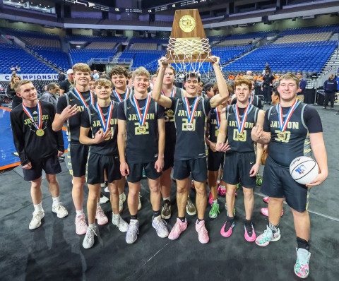 VICTORY AT THE ALAMODOME #1 Jayton Jaybirds no. 20, senior Colt Centry, hoists the State 1A D2 basketball championship trophy alongside teammates March 12, 2026, following a 78–45 victory over #13 Kennard. | COURTESY PHOTO