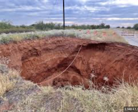 400 DUMP TRUCK LOADS of stone and dirt is what TxDOT estimates will be required to fill a 70-foot-feep sinkhole in rural Cottle County. | TxDOT FACEBOOK PAGE