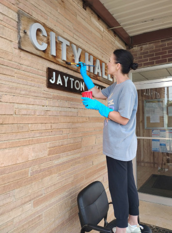Jayton city councilwoman Missy Redford stopped by and gave a paint touch-up to the Jayton City Hall sign last week. | COURTESY PHOTO