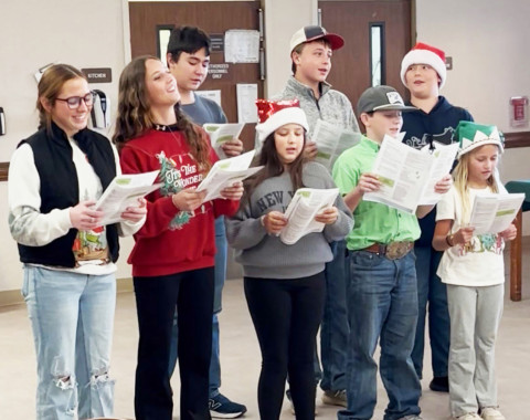 4-H CAROLING Dickens County 4-H spread holiday cheer by singing festive carols for those at nursing homes in Matador and Crosbyton. The joyful faces of the residents lit up as the sweet voices of the 4-H members filled the rooms with music and laughter. The following attended: Tyler Phillips, Paisly Smith, Rylee Foster, Maddee Foster, Henry Chapman, and CalvinHays Chapman, each bringing smiles and warmth to everyone they met. | DICKENS 4-H PHOTO