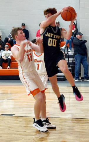 Jaybird Tucker Scott looks to dish off to a teammate in district action in Rotan January 13.