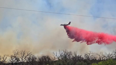 FLYING FIREFIGHTING A large airtanker dropped retardant on the Bell Fire in Dickens County on March 26, 2026. | COURTESY L. MCNEE; TEXAS A&amp;M FOREST SERVICE.