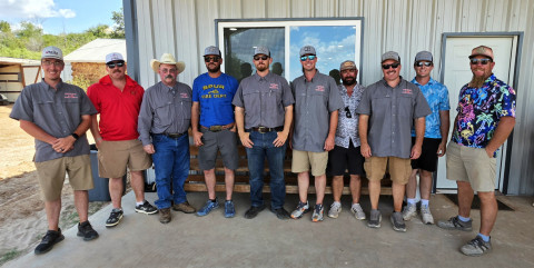 COOL FIREFIGHTERS turned out for a hot day on the Spur links in more colorful duds than when they’re on fire duty.