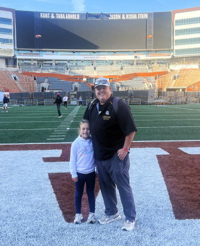 NEW SPUR COACH, ATHLETIC DIRECTOR Mark Weaver, pictured with daughter McKye at DKR Texas Memorial Stadium. | COURTESY PHOTO