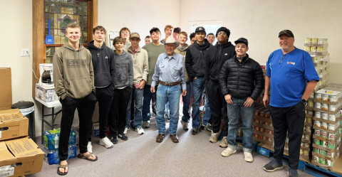 NEIGHBORS HELPING NEIGHBORS Spur Bulldogs athletes delivered KCBD-TV’s annual November food drive supply of turkeys to the Spur Food Bank last week. Food Bank president Tony Ratliff is pictured at center in cowboy hat. | COURTESY PHOTO