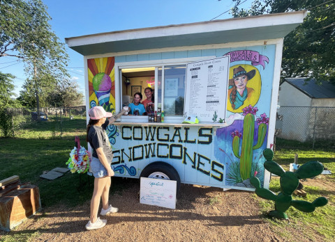 CHILL COWGIRLS Sisters Paisley and Steely Smith, daughters of Emily Smith, are serving up sweet treats from theirCowgalsSnowconestrailer set up behind the Spur Donut Shop on Hill Street in Spur. The stand will be open most days from 5 to 8 p.m. (They’ll put the flag out when they’re open.) The new proprietors are sporting a fresh look for their stand thanks to art from local muralist Vickie Glass Diggs. Cowgals sells snowcones, milk shakes and lemonade. | THE TEXAS SPUR