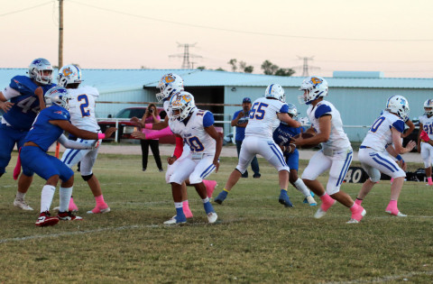 Spur begins district play