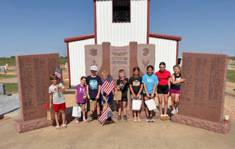 MEMORIALFLAGS Youngsters from Kent County assisted last week in placing U.S. flags at the Girard Cemetery to honor military veterans buried there. From left, participants were Noah Bryant, Kate Appleby, Micah Appleby, Wade Appleby, Quincy Hall, Violet Vargas, Marley Nall, Paisley Bryant and McKye Hall; Sidney Hall was not pictured. | COURTESY PHOTO