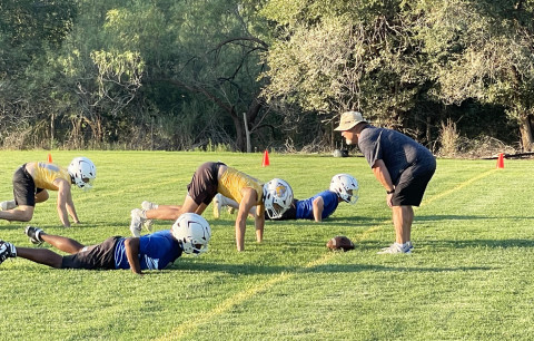 BACK IN THE BLUE The Spur Bulldogs have begun summer practices under the leadership of Head Coach Tate Clark (above, in left photo), who was outforanextendedsickleavein 2024. Last year the team went undefeated in District under the substitute coaching of Superintendent Craig Hamilton (above, in right photo)—who’s assisting in the early going this year. | TEXAS SPUR