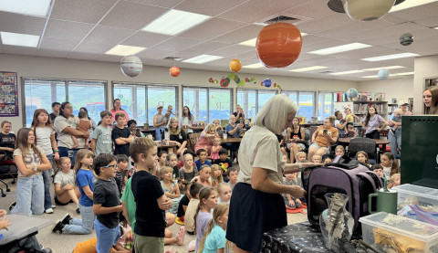 WHAT ON EARTH is about to come out of that carrier? A capacity crowd of youngsters and parents waited to find out, as South Plains Wildlife Rehabilitation staffers prepared to talk about how to “Unearth a Story” in this year’s summer reading theme with numerous rescued reptiles, mammals and birds. Programs continue at the Dickens County Spur Public Library Tuesday mornings at 10, for the next three weeks. | TEXAS SPUR