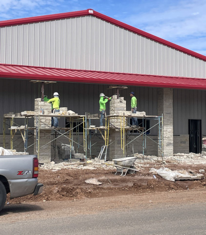 Rock facing on the façade and columns of the new Spur firehouse on Burlington Avenue was nearly complete by the end of last week. Inside, work is also progressing on wall structures and electrical service. | THE TEXAS SPUR