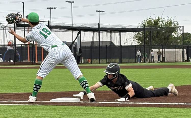 JAYBIRD BODE HAM gets back to first base in time on a pickoff attempt in Jayton’s bi-district game April 29 in Clyde.