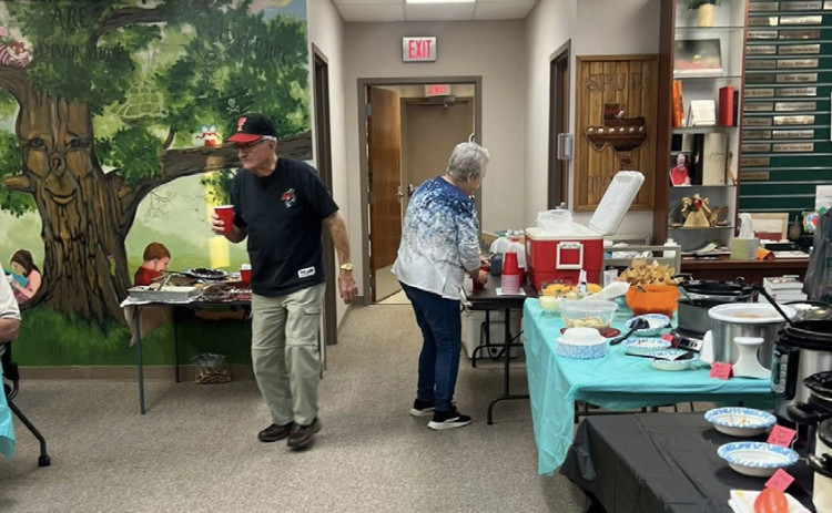 Chili sampling makes for a warm welcome to library dinner