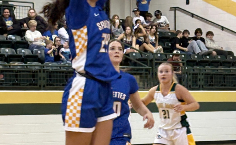 SPURETTE DEFENSE Keylee Molina goes up to defend with help from teammate Kendal Walker in the Spurettes loss to Guthrie Feb. 6. | SUE JANE SULLIVAN
